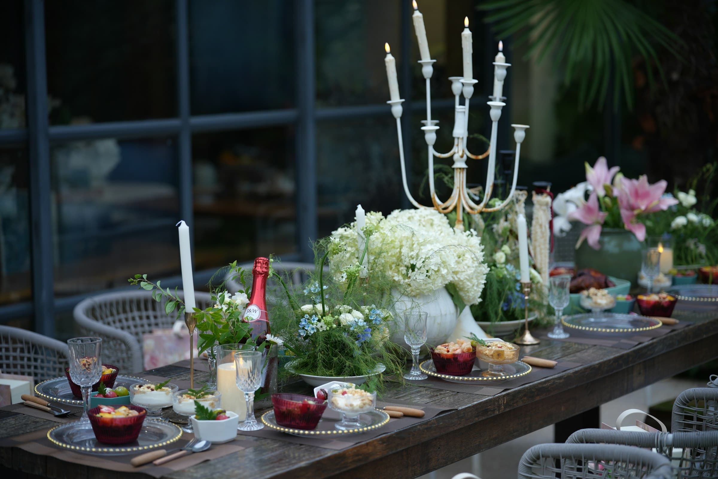 A candlelit manor garden set for an intimate celebration